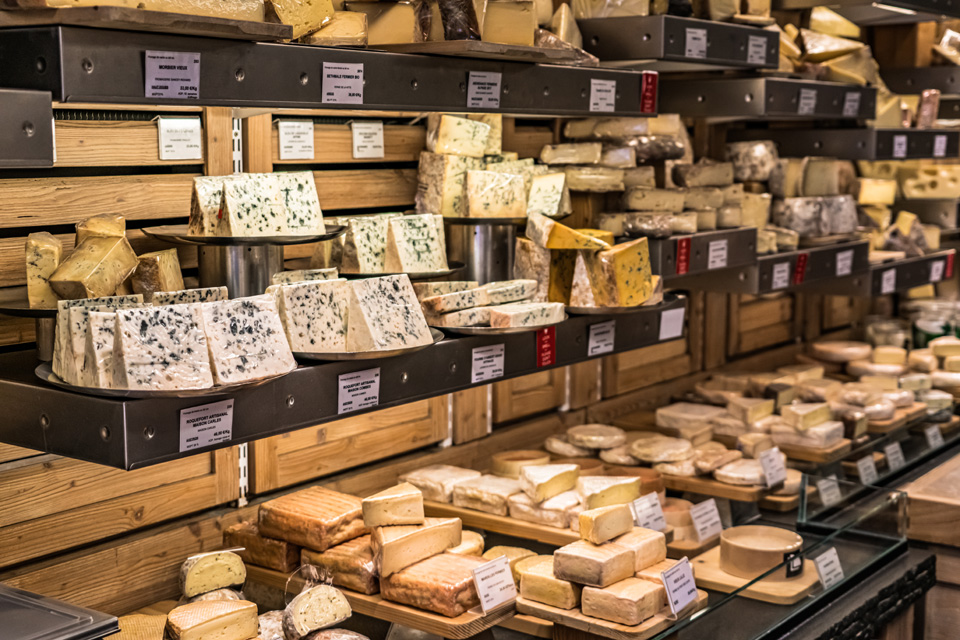 A Shop in Paris, France selling various cheeses